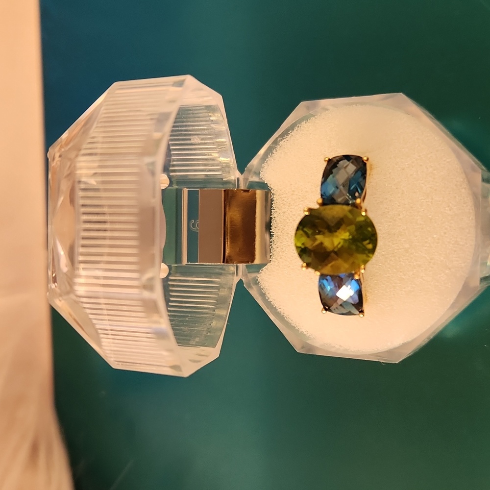 Size 7 10k gold ring with peridot and royal blue topaz. Never worn